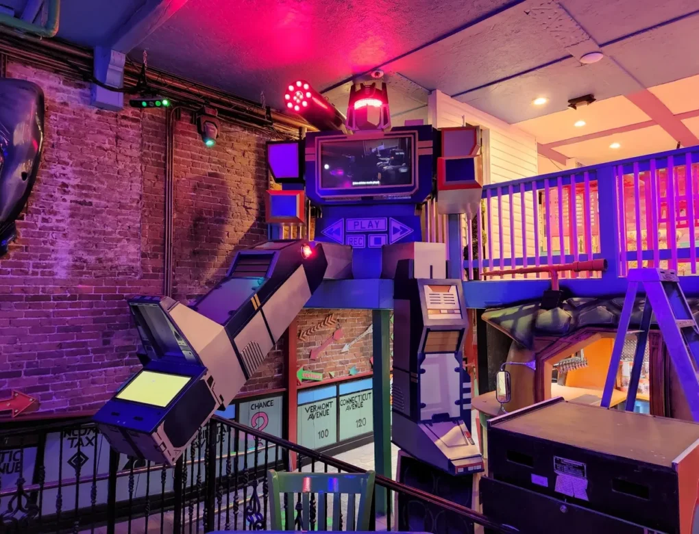 Goblin Studios located in Parramore near downtown Orlando - colorfully lit interior including a robot figure in the foreground and a brick wall in the background
